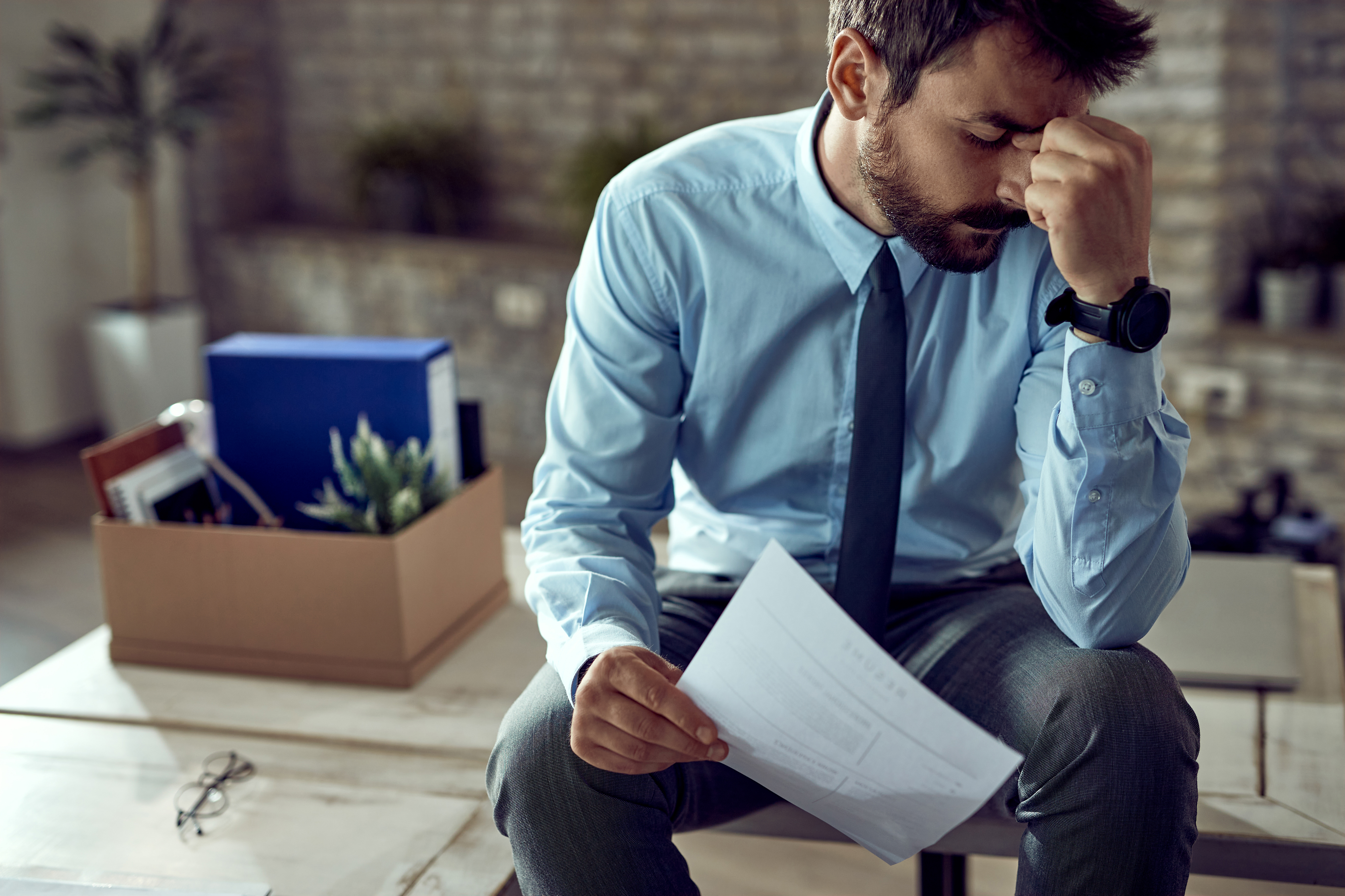 Prospective homebuyer reviewing mortgage documents after rebuilding credit following bankruptcy.