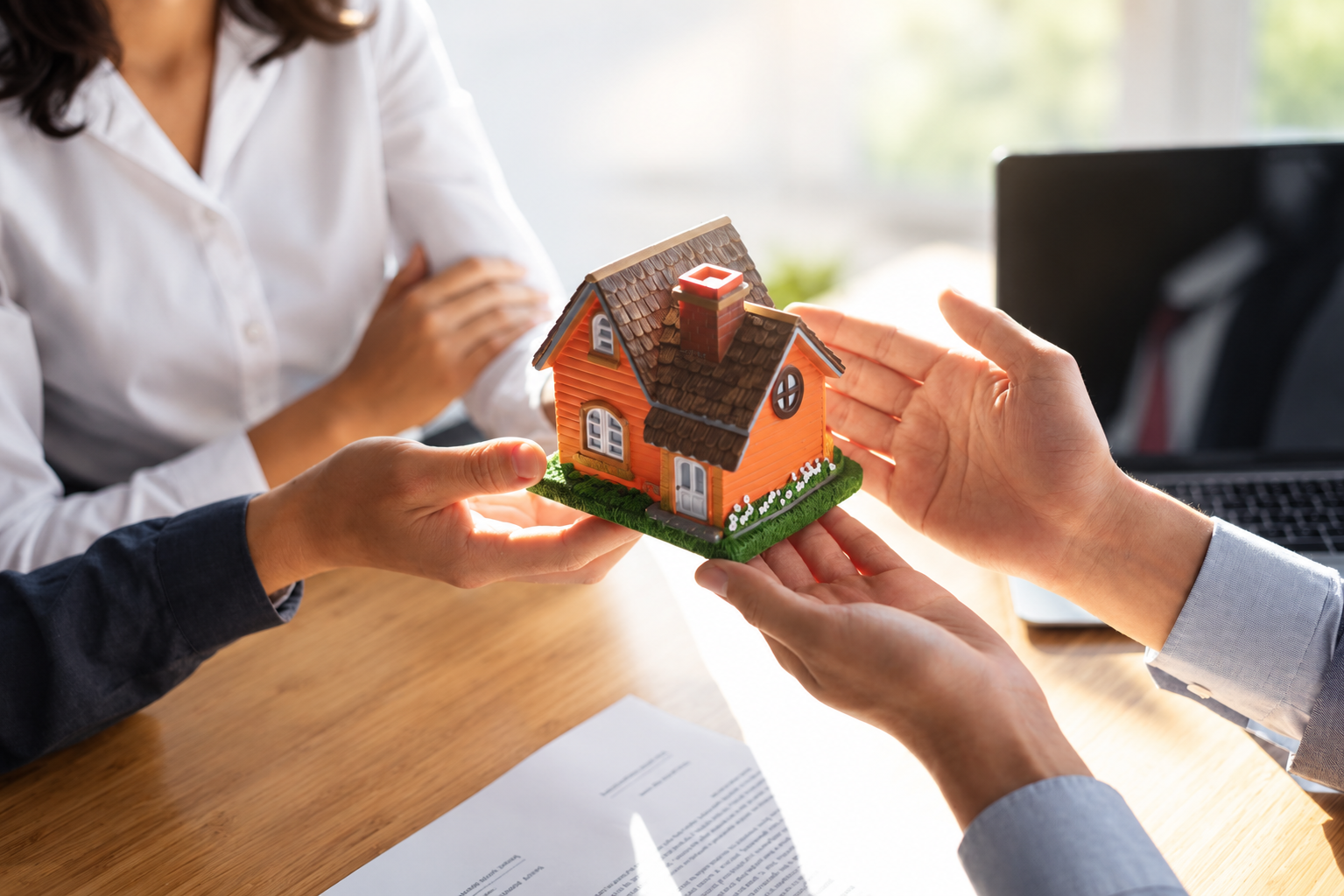 Home equity and mortgage refinancing with a house model and financial documents